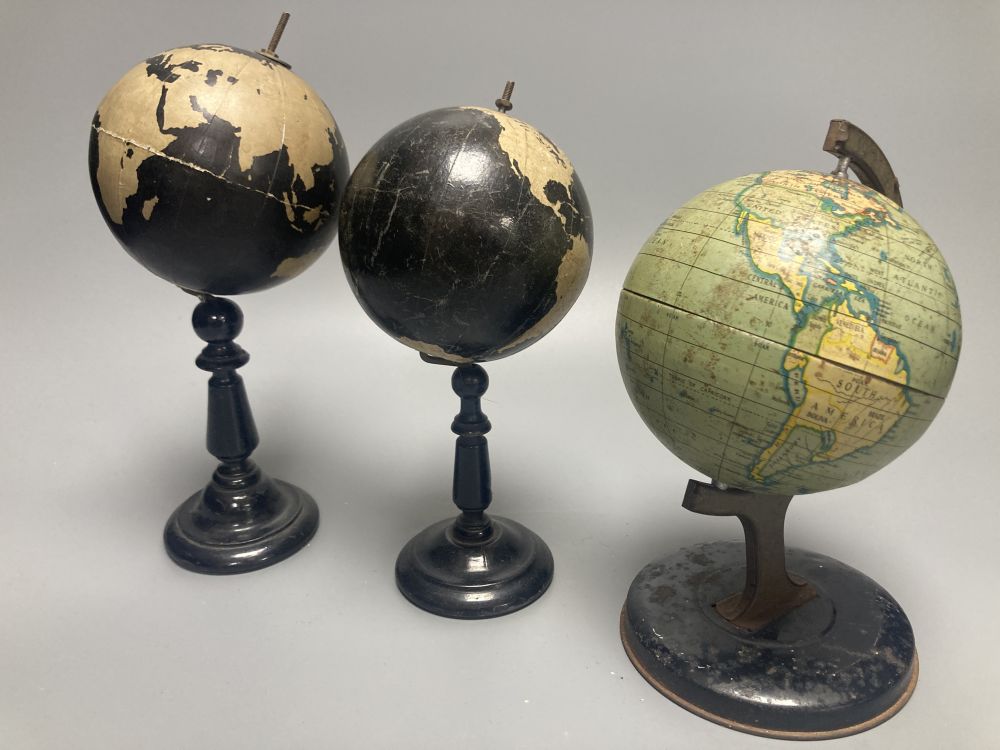 A Reliable Series lithographed tinplate revolving globe, 20cm, and two graphic globes,on ebonised wood bases, one by Philips